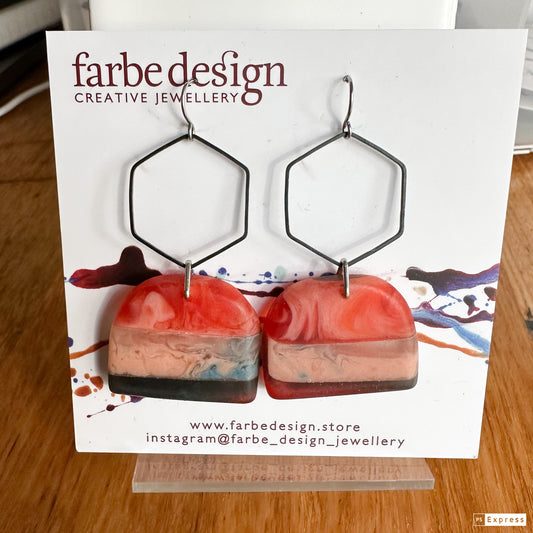 Swinging sisters: contemporary resin earrings, red and nude with black highlights