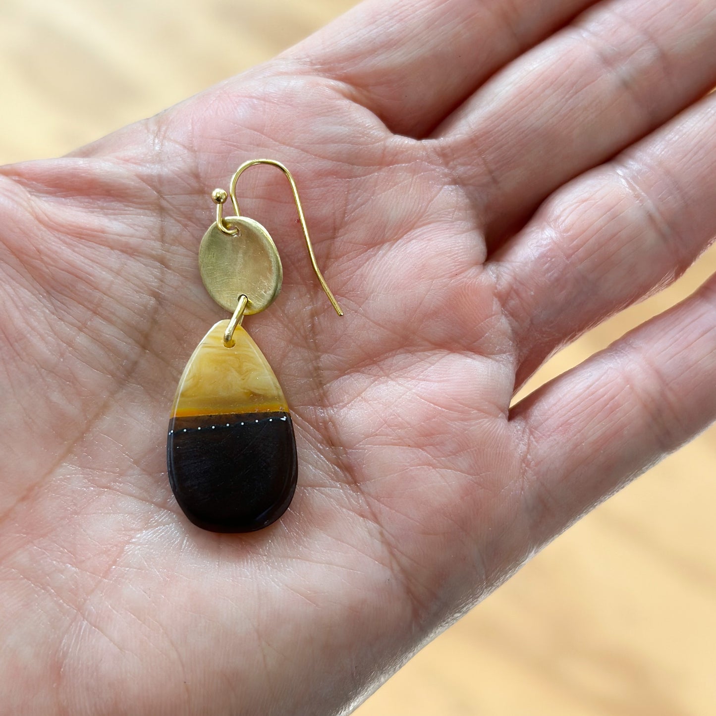 Wild things: umber and amber bio-resin tear drop earrings with beaten brass discs