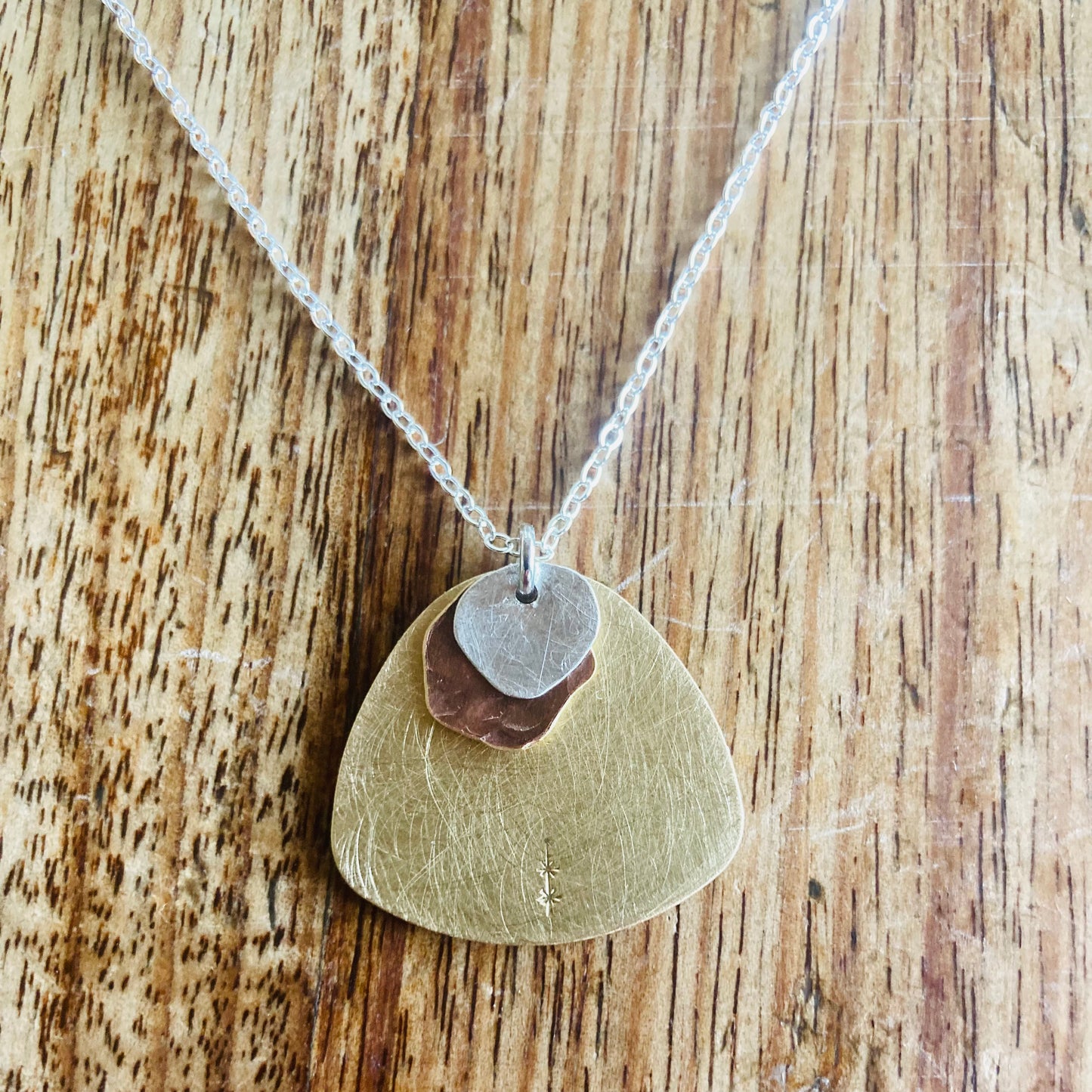 Cascading Cloud Pendant. Layers of sterling silver, copper and brass, the perfect pendant to complement any outfit.