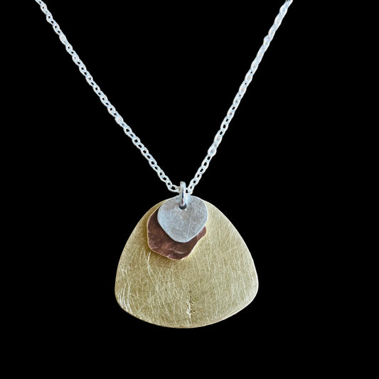 Cascading Cloud Pendant. Layers of sterling silver, copper and brass, the perfect pendant to complement any outfit.