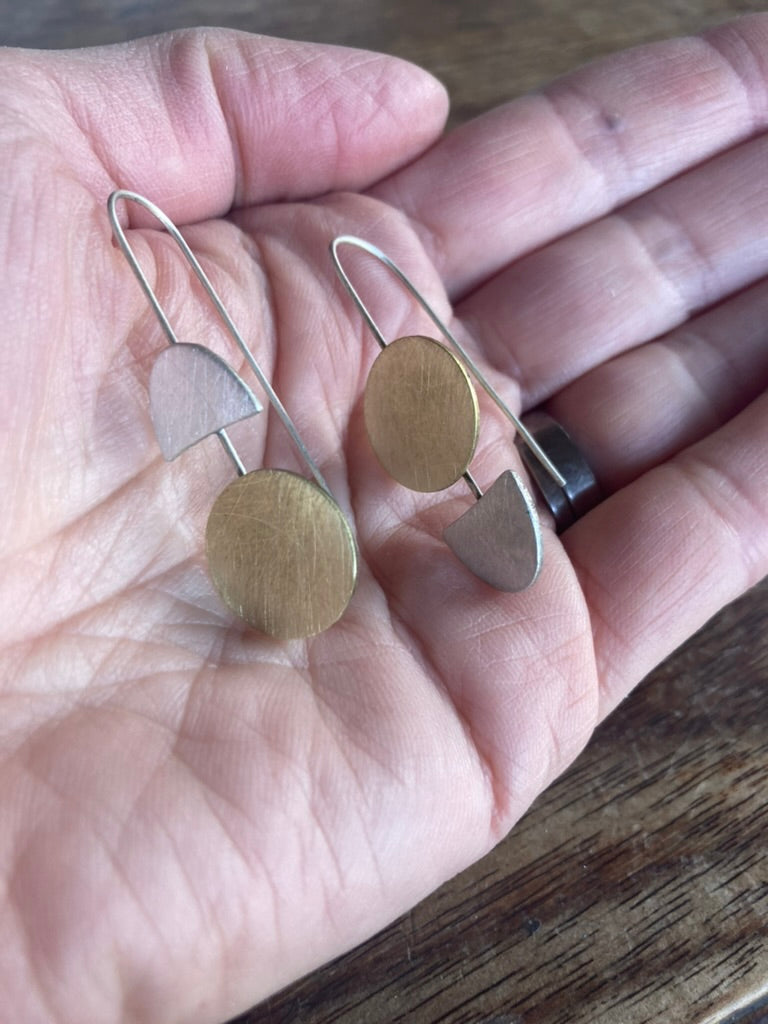 Lessons in Geometry. Same, same but different. Our fabulous geometric earrings with a twist. Sterling silver and brass.