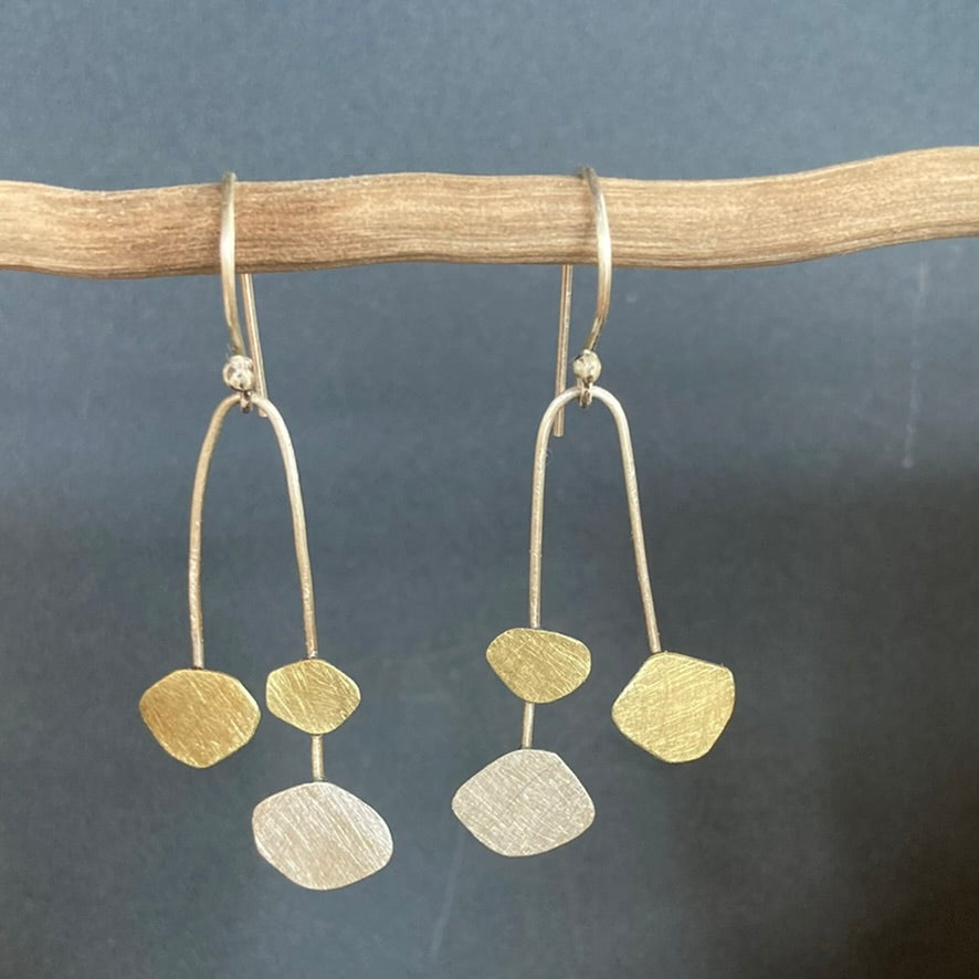 Mobile Cloud earrings. Our homage to Calder, these beauties celebrate whimsy, dancing clouds in Sterling silver and brass. Sterling silver ear hooks.