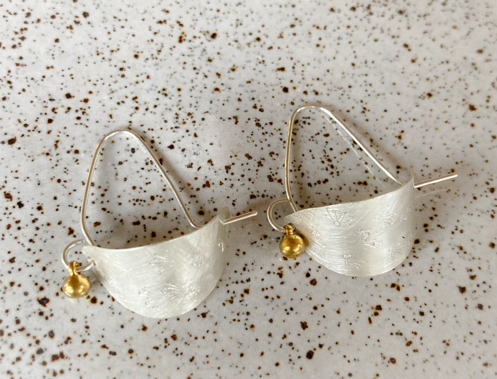 Swinging Sister, sterling silver hoop earrings. Featuring flower petal embossed detail and brass drop.