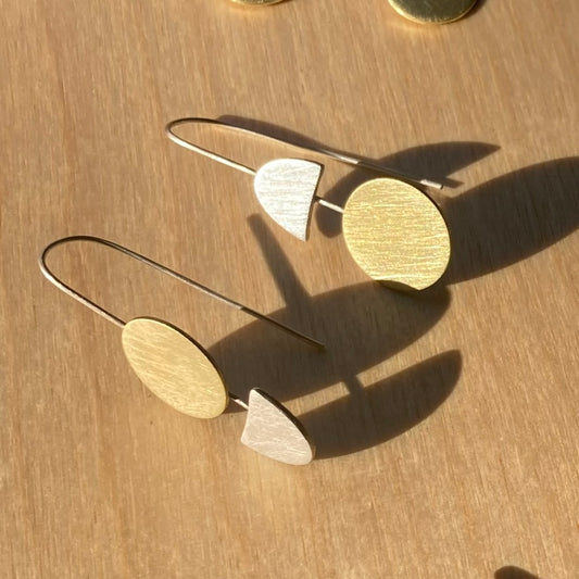 Lessons in Geometry. Same, same but different. Our fabulous geometric earrings with a twist. Sterling silver and brass.