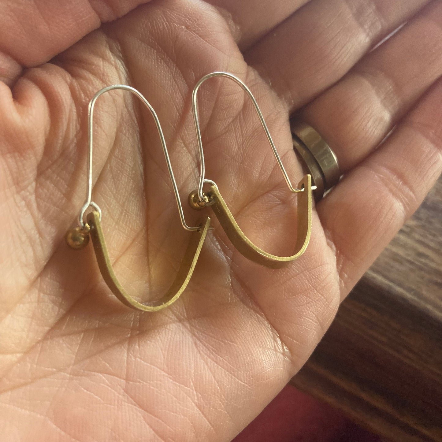 Swinging Sisters, brass and sterling hoop earrings. Featuring embossed detail and brass drop for extra fabulousness.