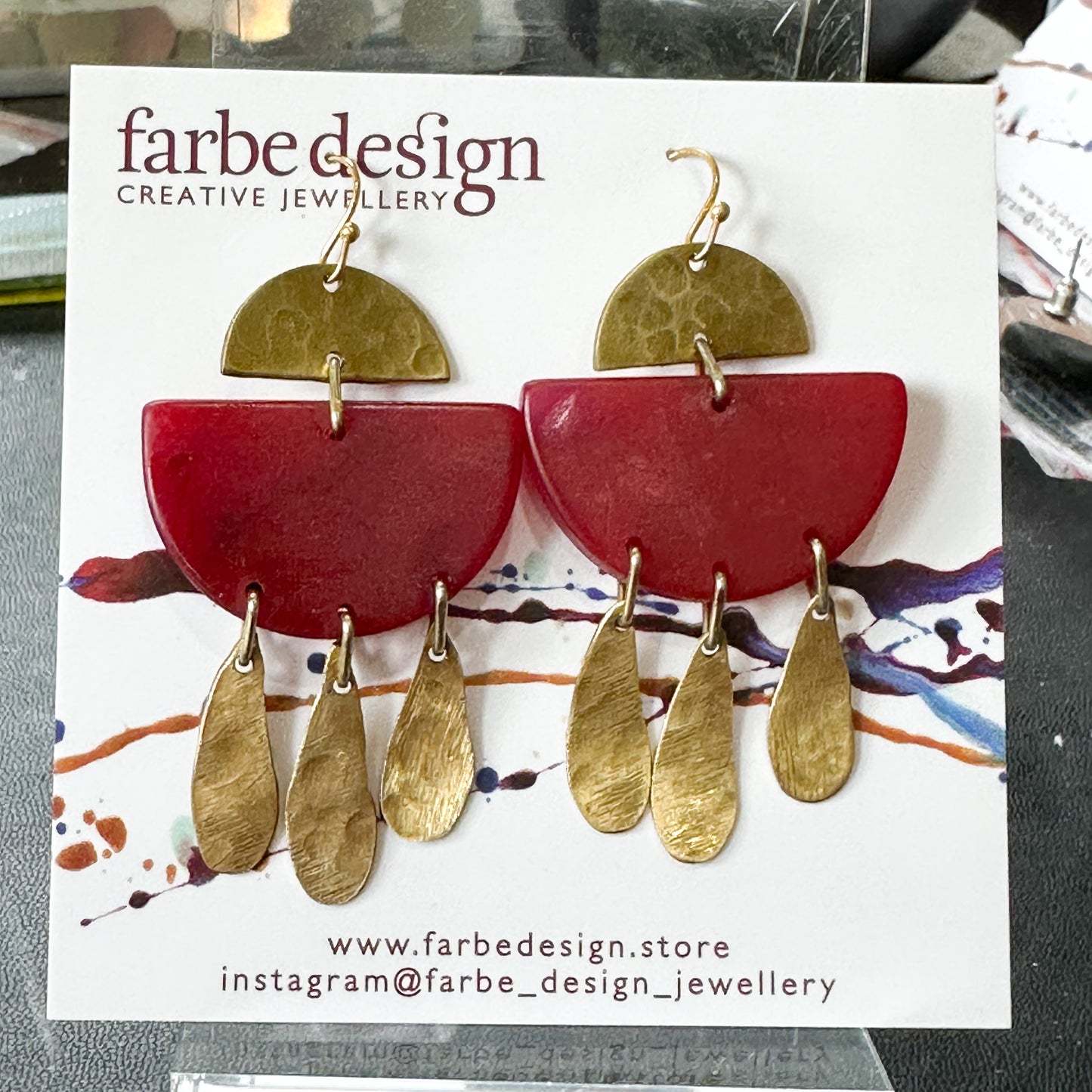 Swinging Sisters: ruby red dangles with brass details