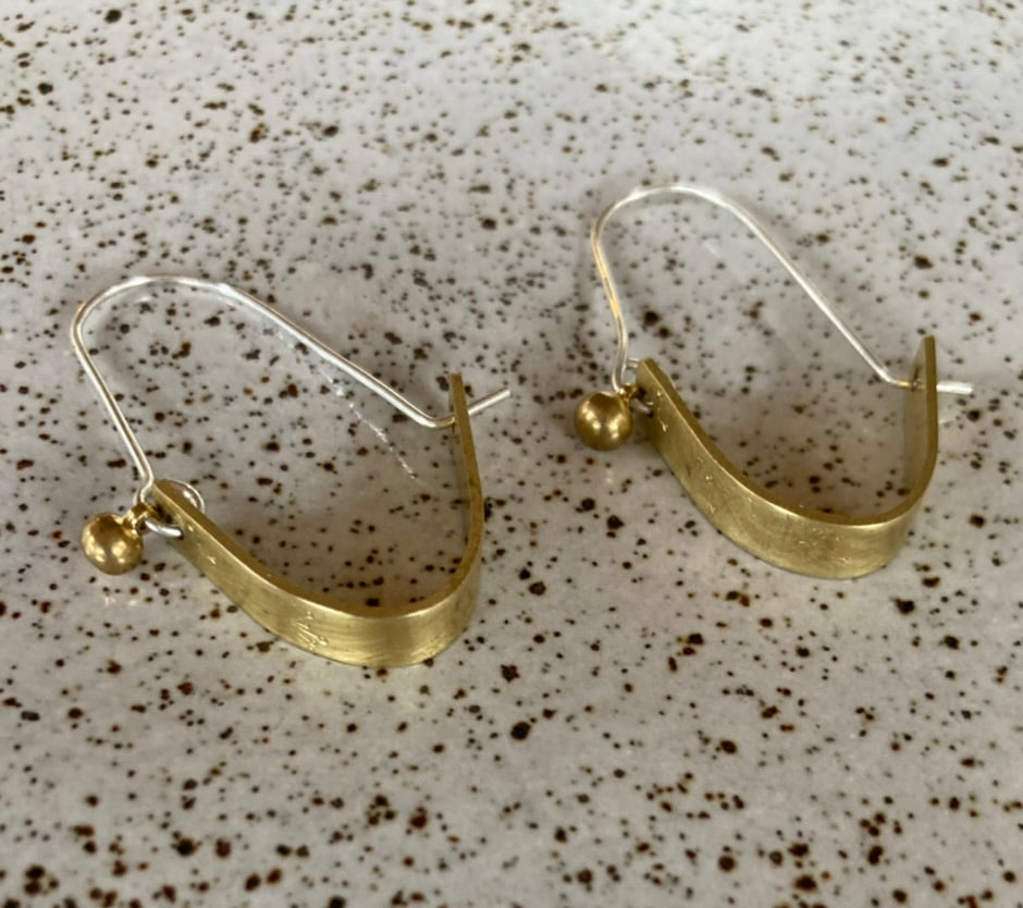 Swinging Sisters, brass and sterling hoop earrings. Featuring embossed detail and brass drop for extra fabulousness.