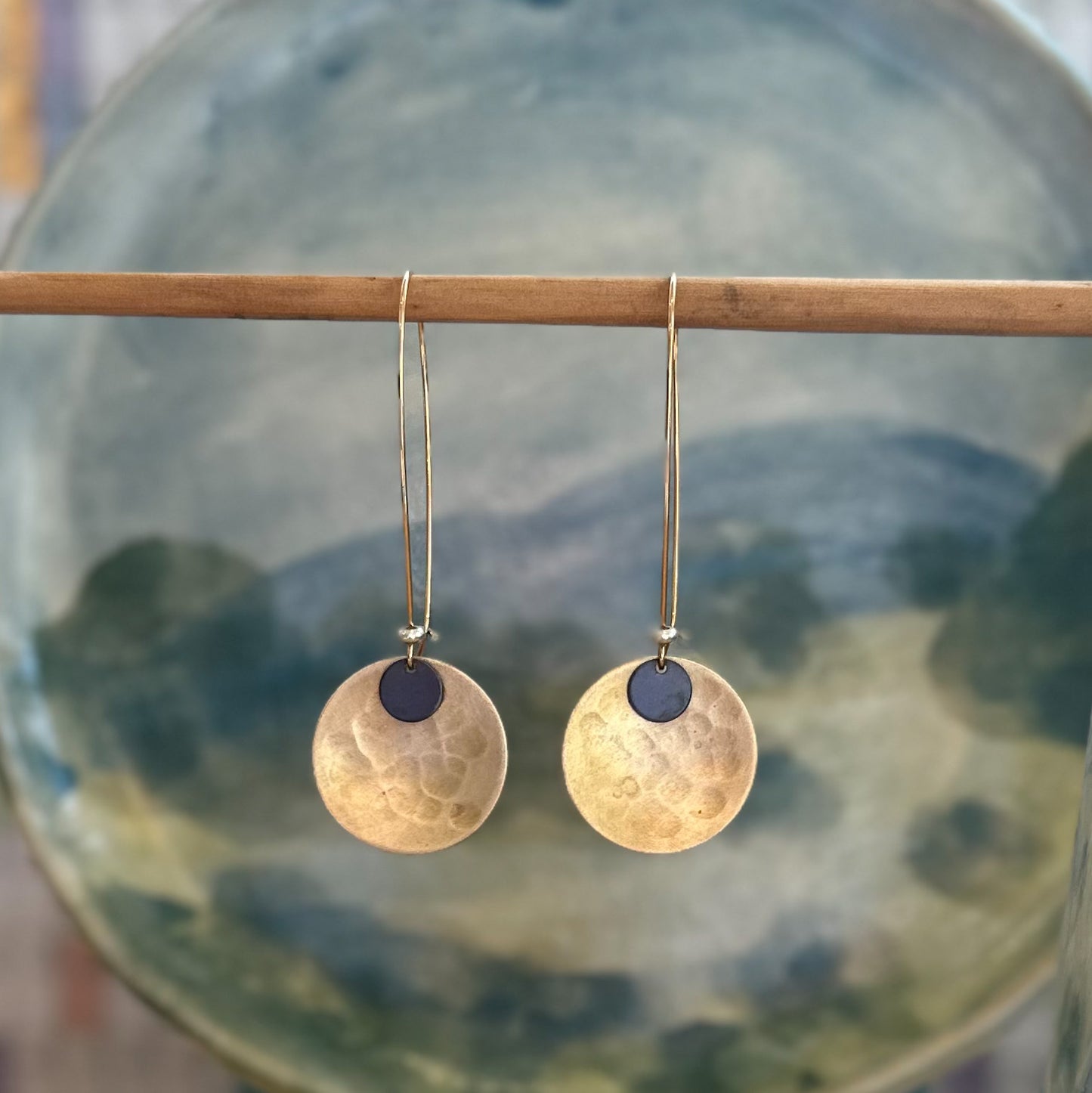 Wanderers: beaten brass concave discs with oxidised metal detail