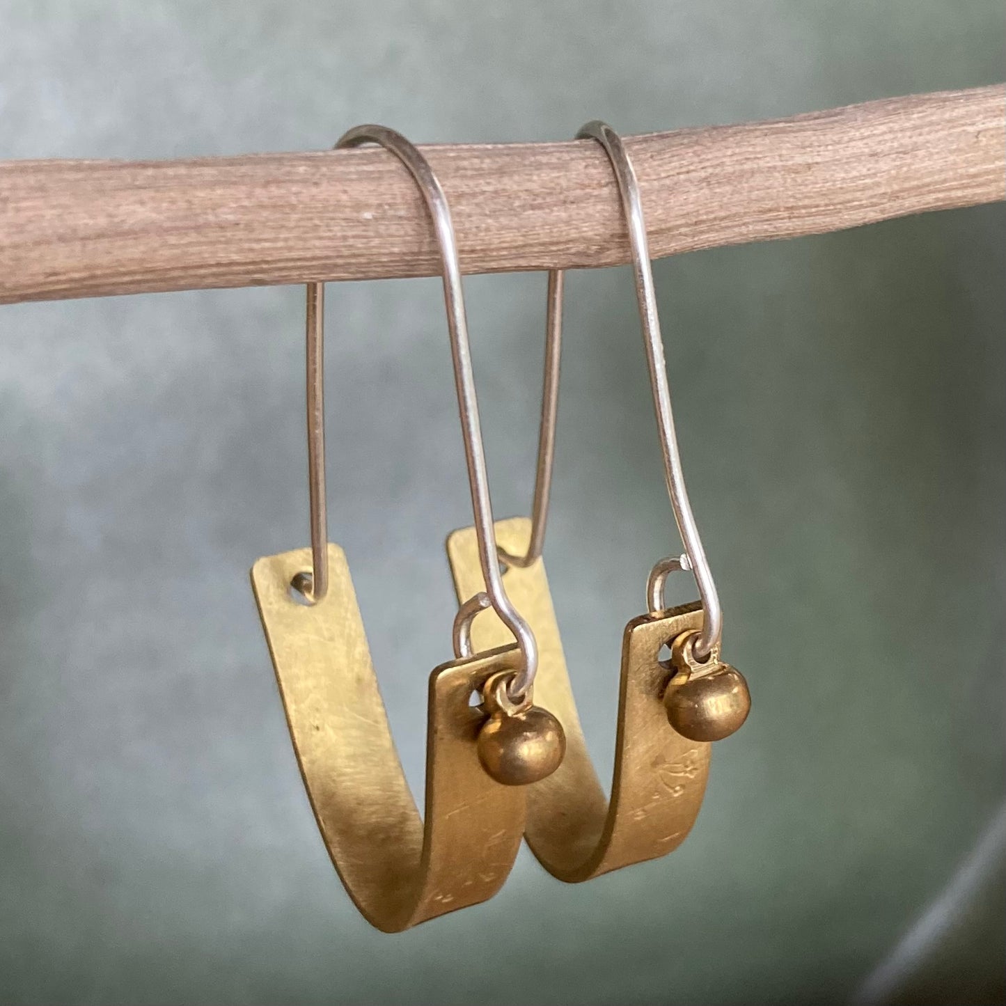 Swinging Sisters, brass and sterling hoop earrings. Featuring embossed detail and brass drop for extra fabulousness.