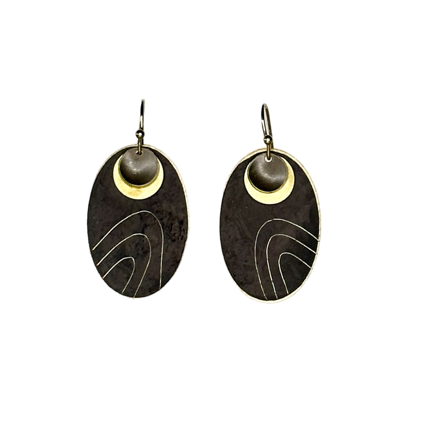 Wanderers: black oxidised metal with etched contours and brass detail