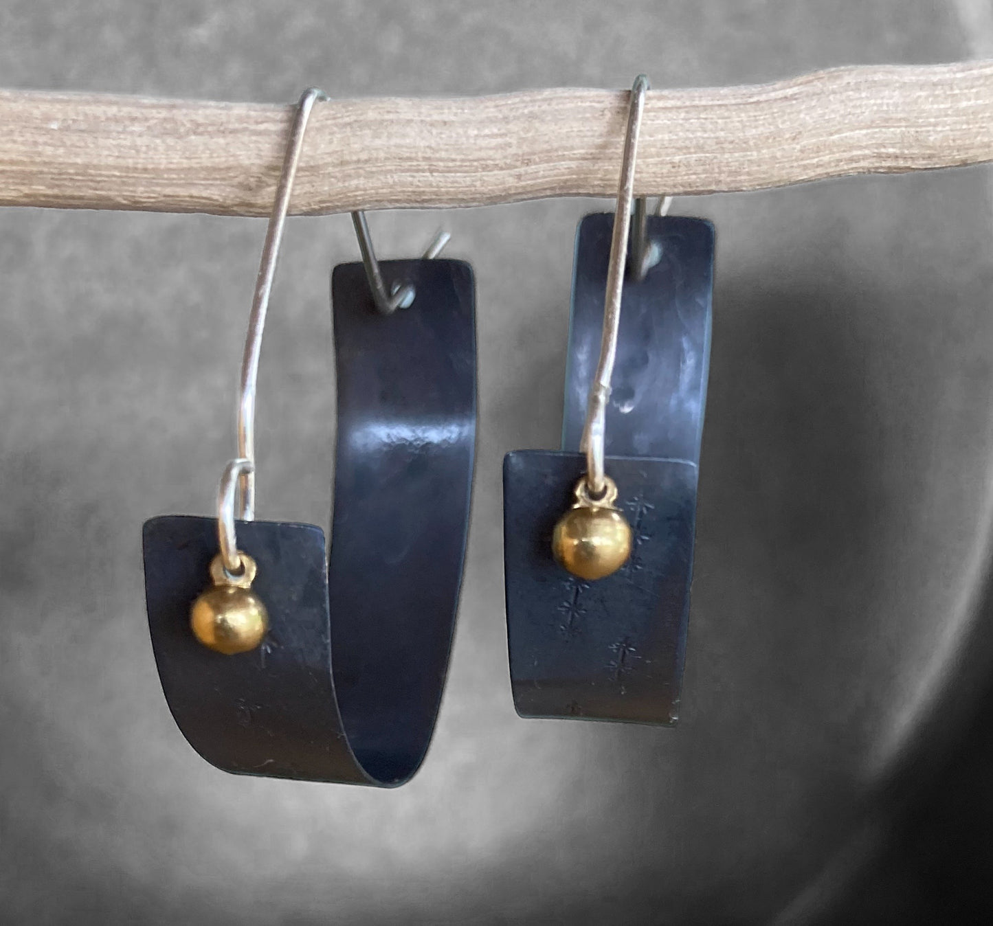 Swinging Sister - Oxidised sterling silver large hoop earring, feature embossed detail and brass drop.