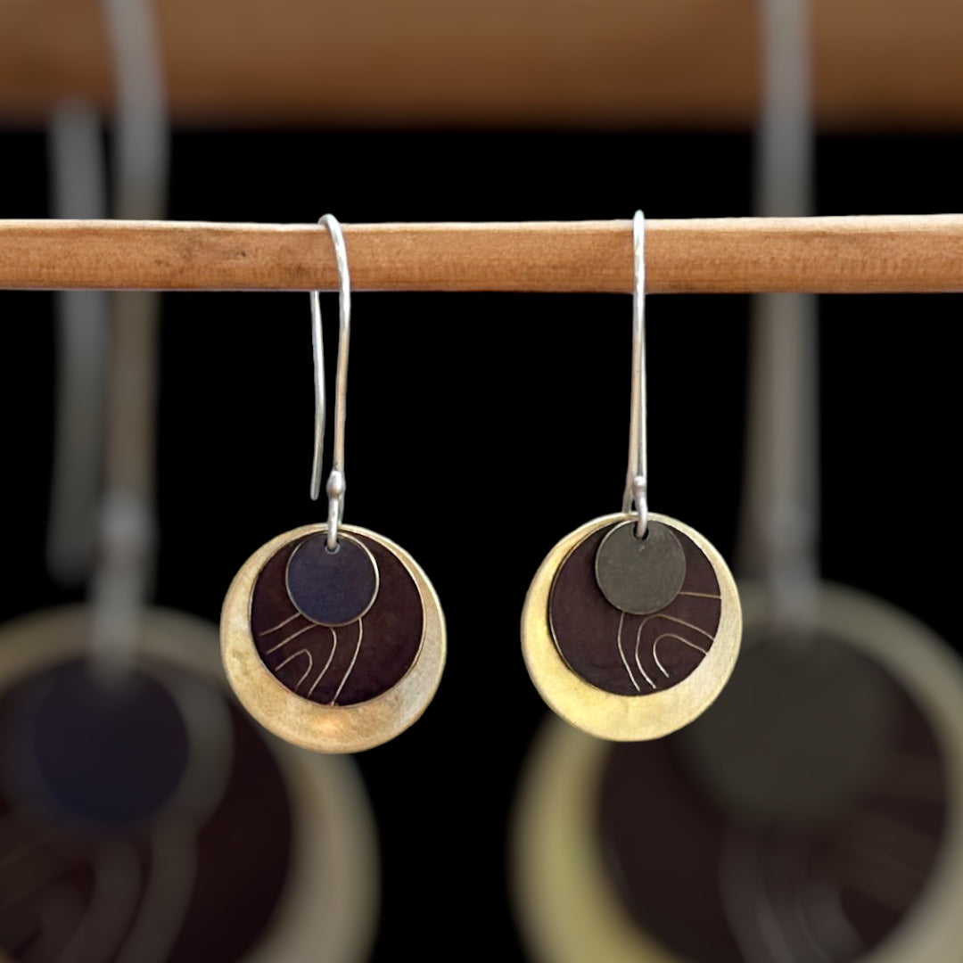 Wanderers: beaten brass discs with hand etched brown patina and oxide metal small disc on sterling silver ear hooks