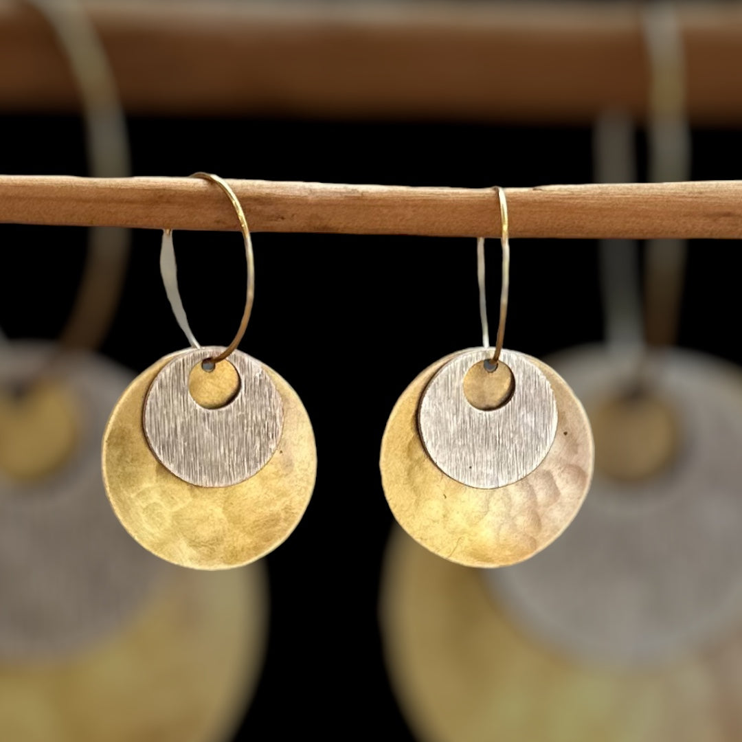 Wanderers: beaten brass discs with silver plated concave disc on gold hoops