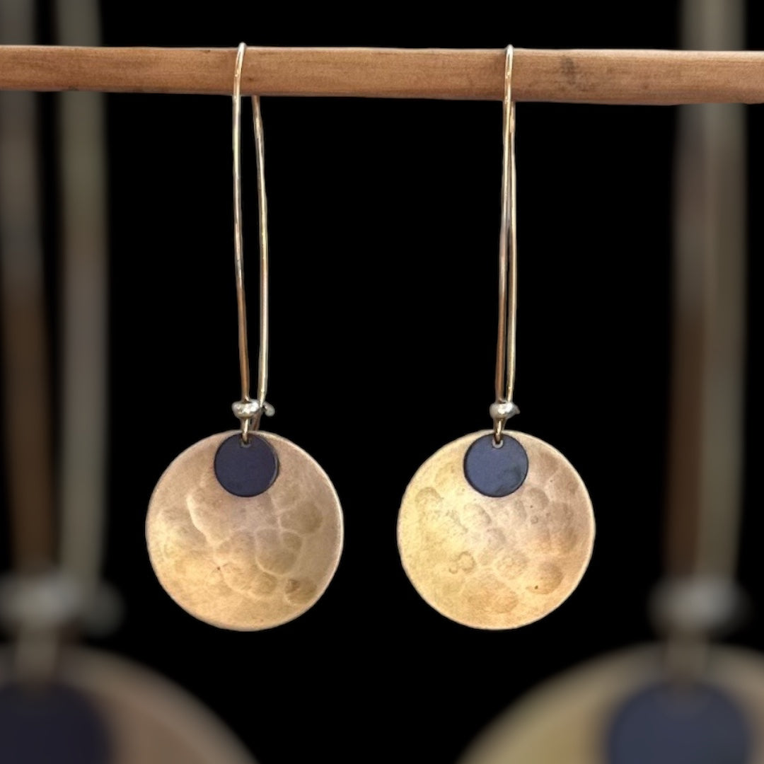 Wanderers: beaten brass concave discs with oxidised metal detail